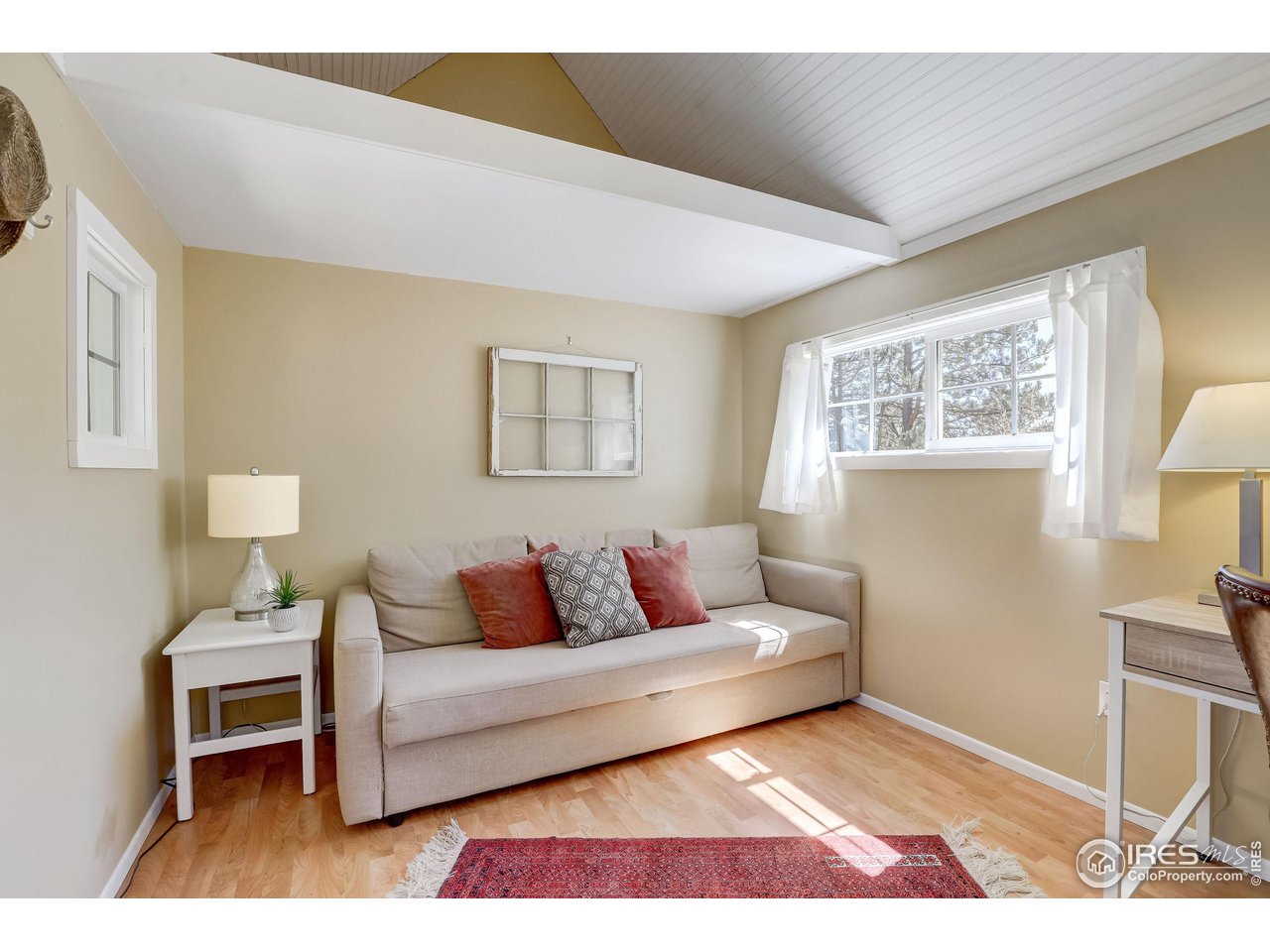811 County Road 83 Boulder, CO 80302 - Photo 28 of 38 a living room with furniture a lamp next to a window
