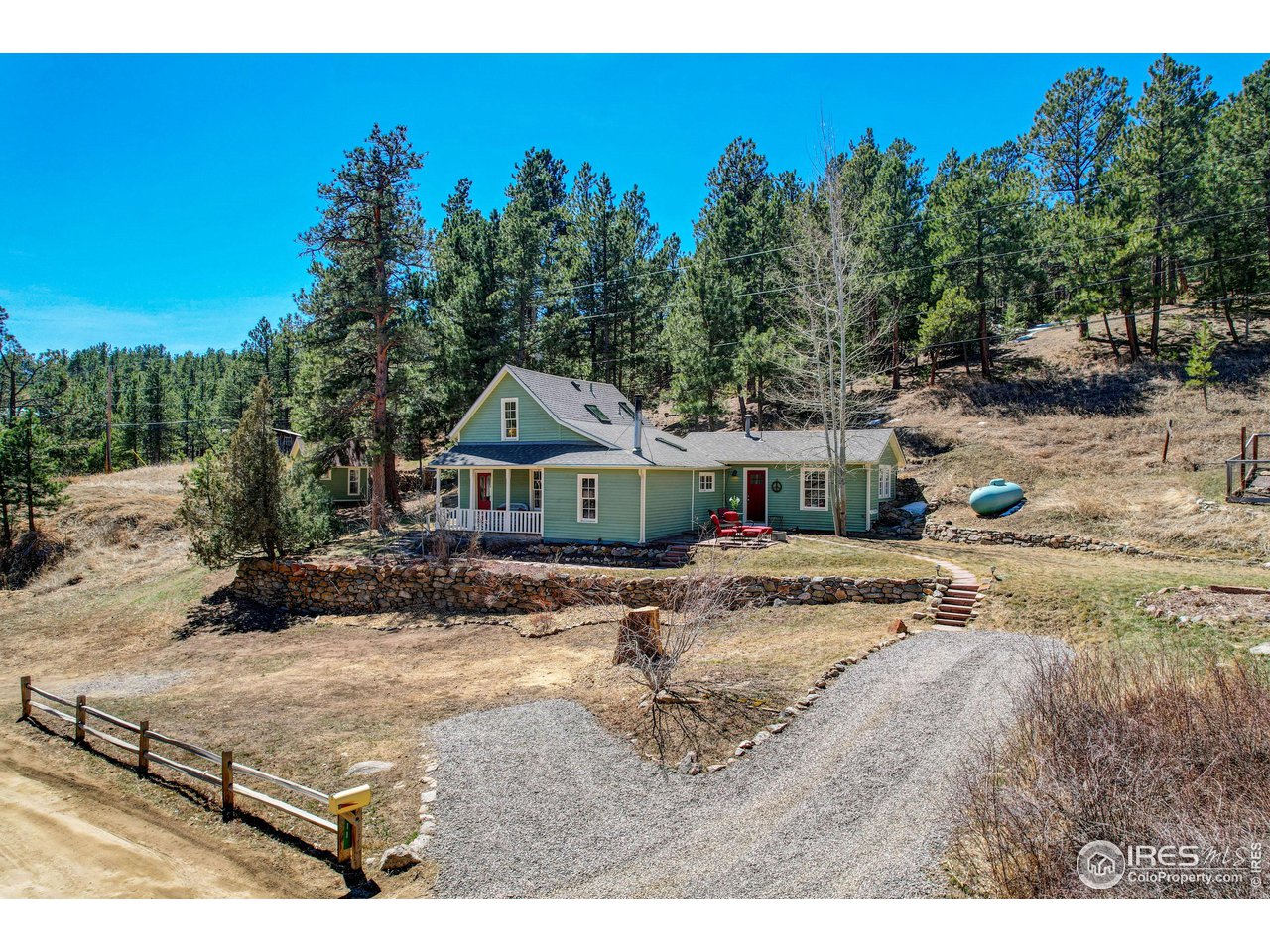 811 County Road 83 Boulder, CO 80302 - Photo 33 of 38 a view of a house with a yard