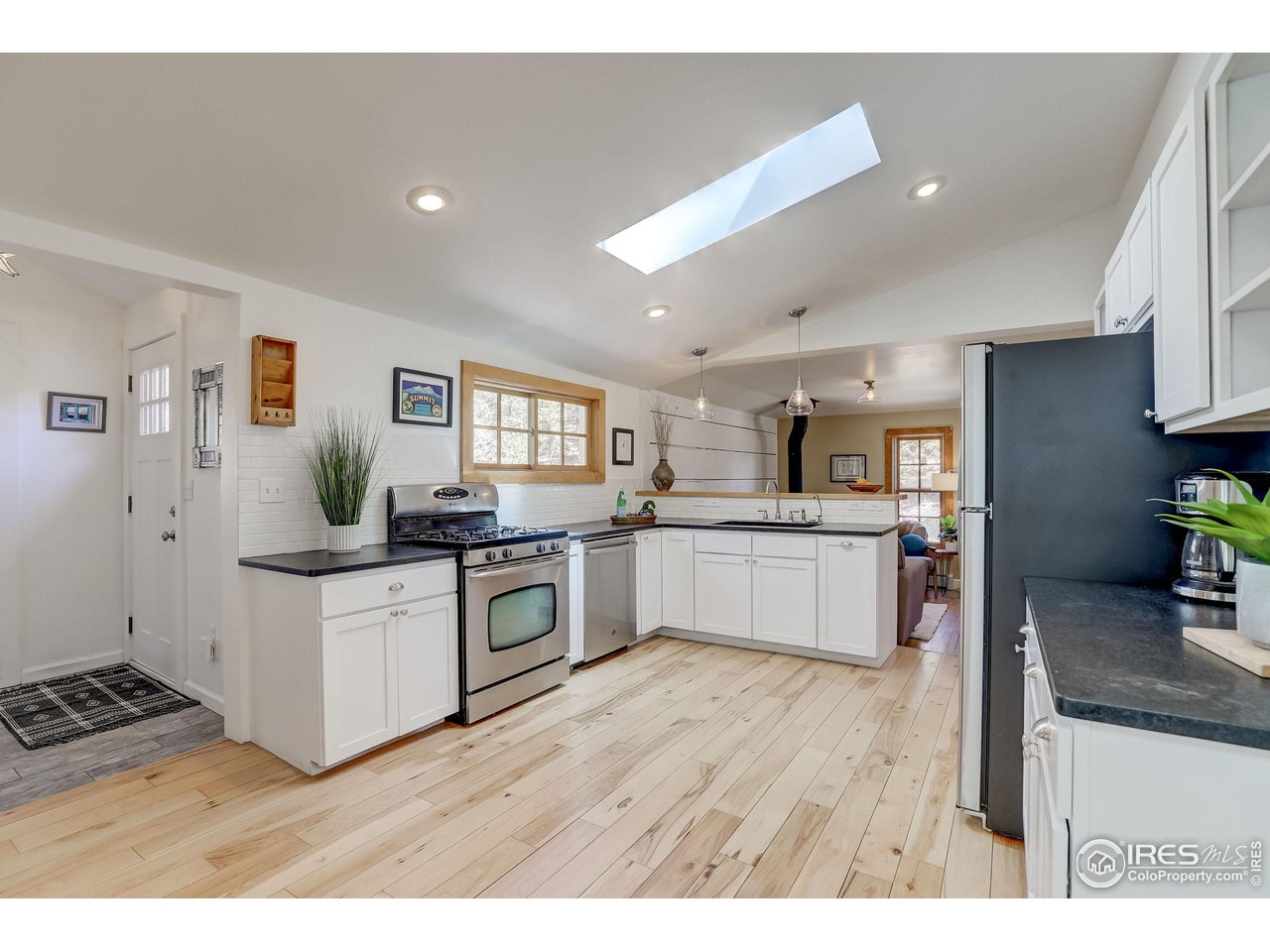811 County Road 83 Boulder, CO 80302 - Photo 5 of 38 a kitchen with stainless steel appliances granite countertop a stove a sink dishwasher and a refrigerator