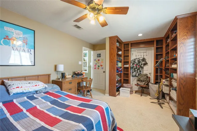 a bedroom that has a bed and a walk in closet
