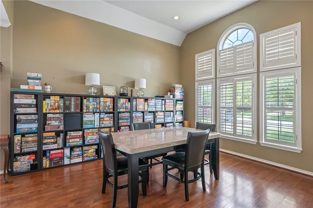 a view of a livingroom with furniture window and wooden floor