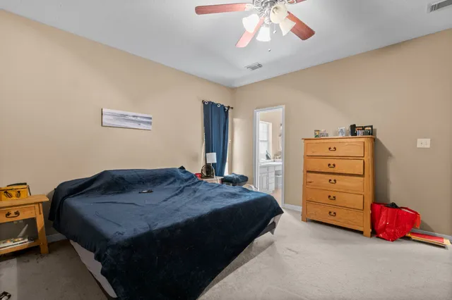 a bedroom with a bed and a closet