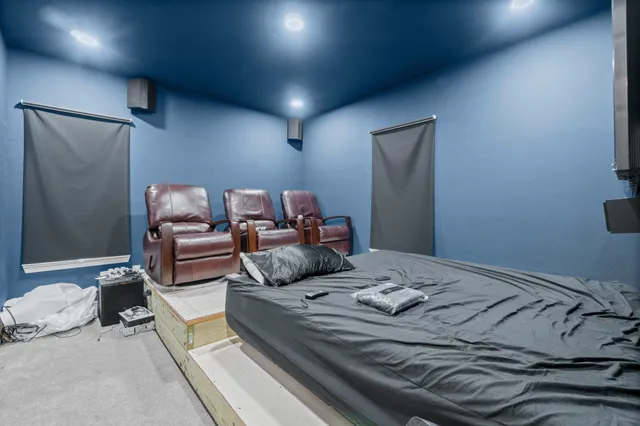 a bed room with a bed and a chair