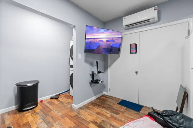 a room that has a bed and a chair in it