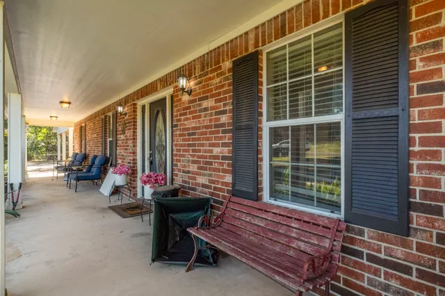 a view of a two chairs in the balcony