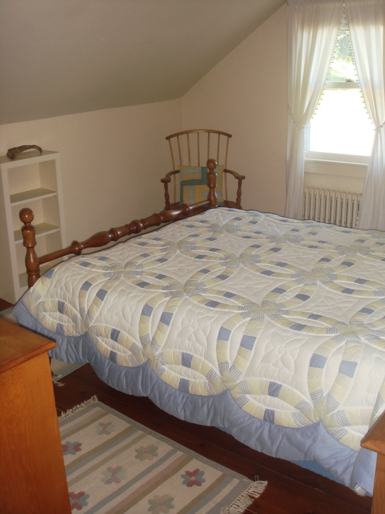 404 Middle Road Clarksburg, MA 01247 - Photo 13 of 16 a bedroom with a bed and a window