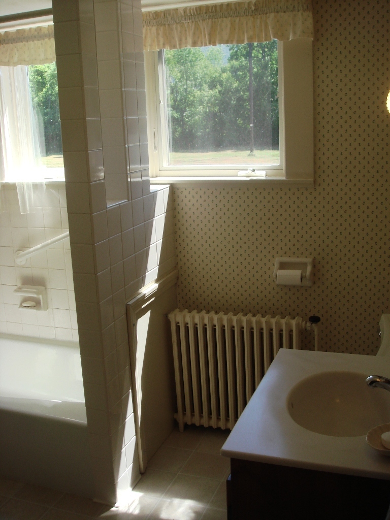 404 Middle Road Clarksburg, MA 01247 - Photo 15 of 16 a bathroom with a sink and a bathtub