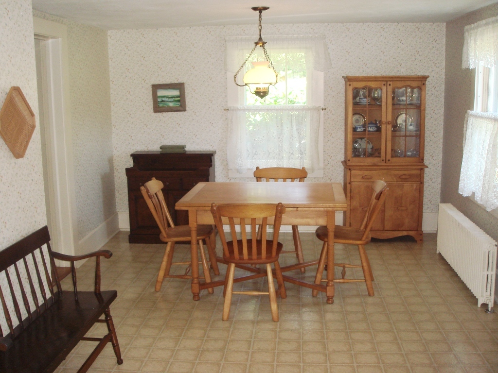 404 Middle Road Clarksburg, MA 01247 - Photo 5 of 16 a view of a dining room with furniture and a chandelier