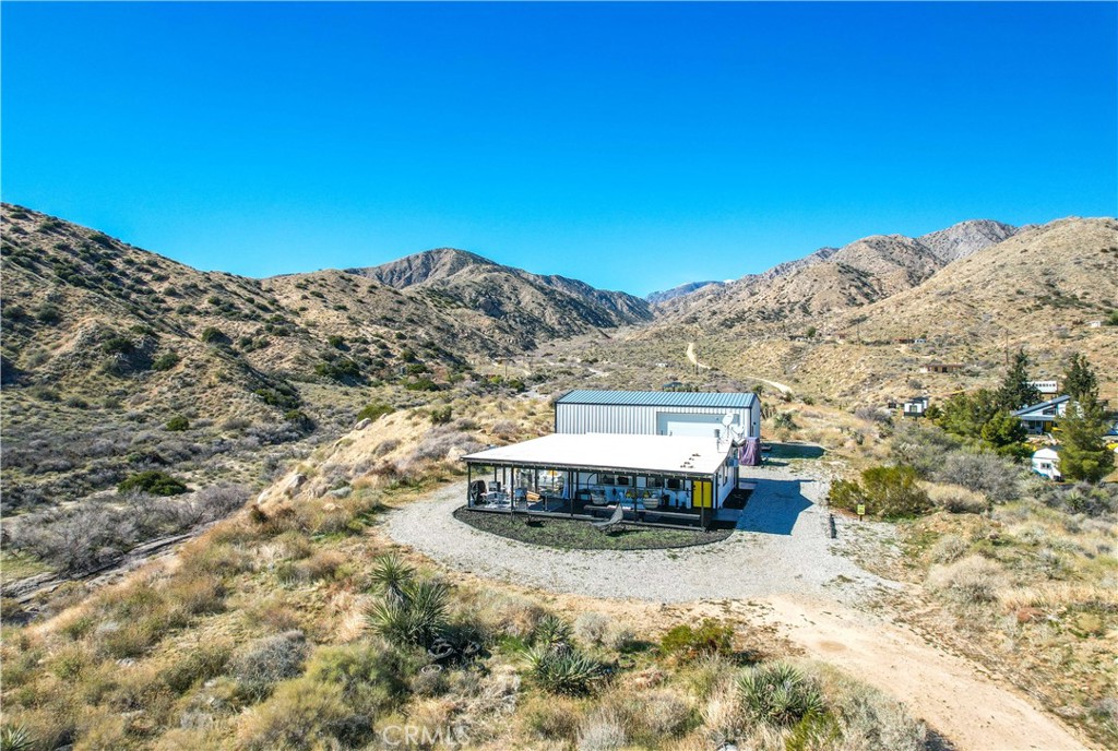 49490 Big Morongo Canyon Road Morongo Valley, CA 92256 - Photo 62 of 75 a view of a large building with a mountain