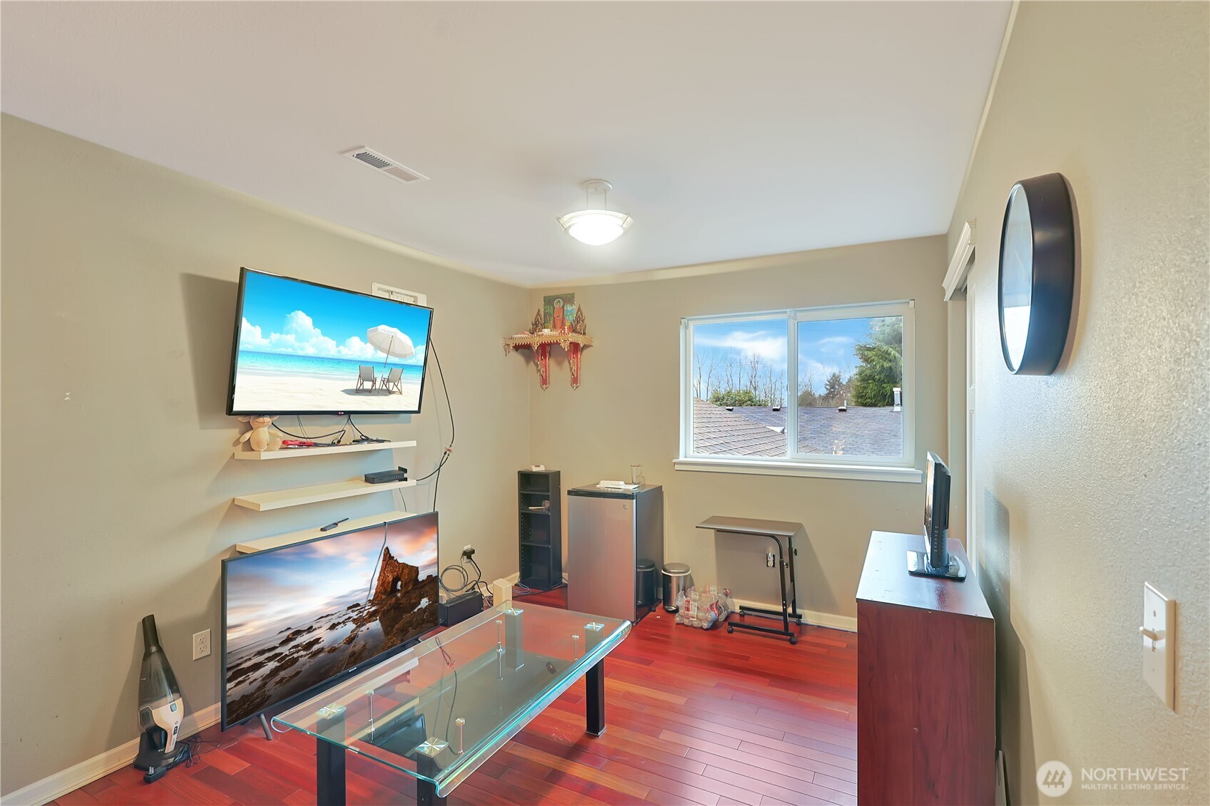 11107 Southeast 162nd Street, Unit B Renton, WA 98055 - Photo 11 of 15 a living room with furniture and a fireplace