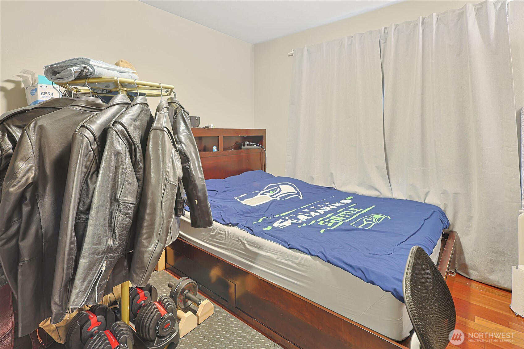 11107 Southeast 162nd Street, Unit B Renton, WA 98055 - Photo 12 of 15 a view of a bedroom with clothes and shoes
