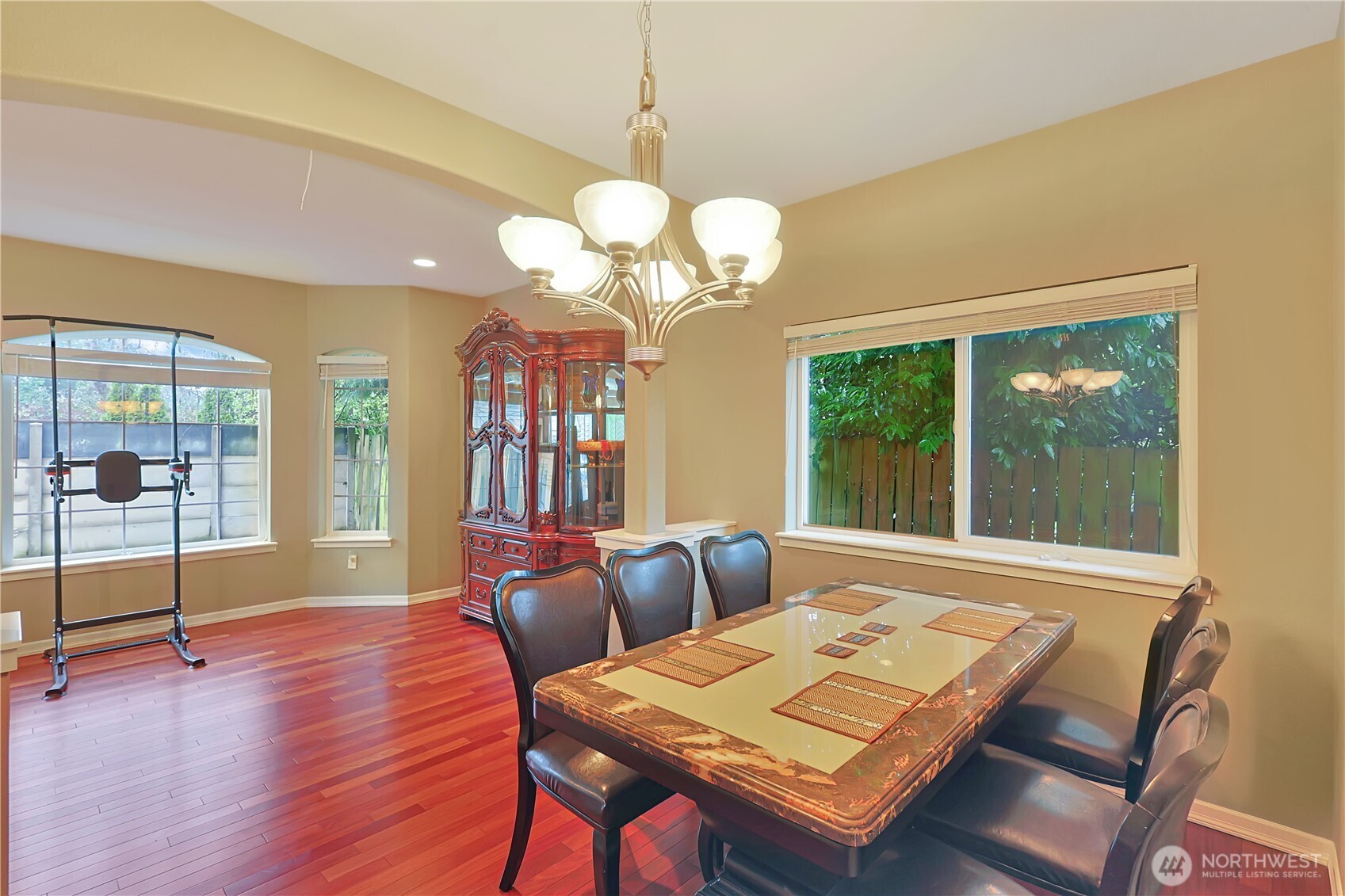 11107 Southeast 162nd Street, Unit B Renton, WA 98055 - Photo 3 of 15 a living room with furniture a chandelier and a large window