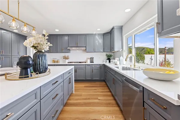 a kitchen with a table chairs stove and microwave