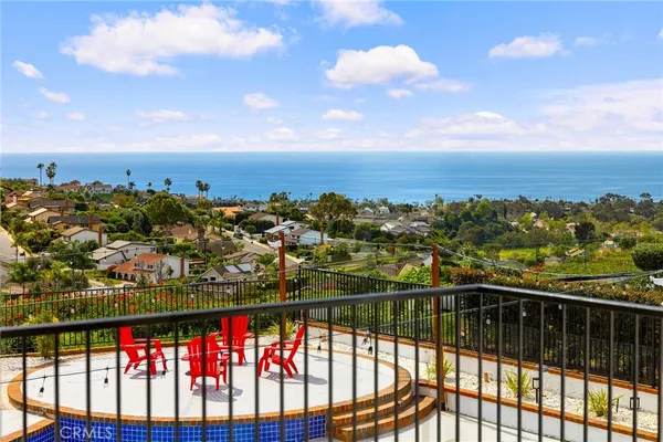 a view of a swimming pool with outdoor seating