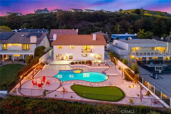a view of swimming pool with furniture