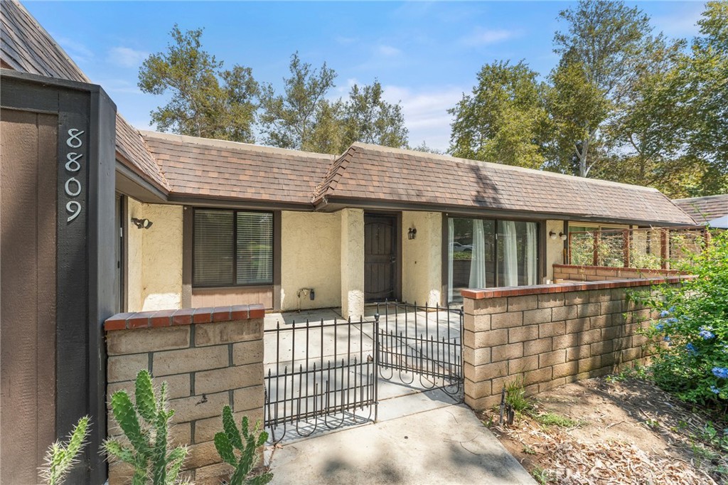 8809 Amigos Place Riverside, CA 92504 - Photo 1 of 1 a view of a house with a porch
