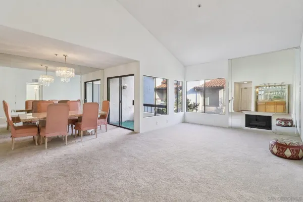 a large room with furniture and a large window