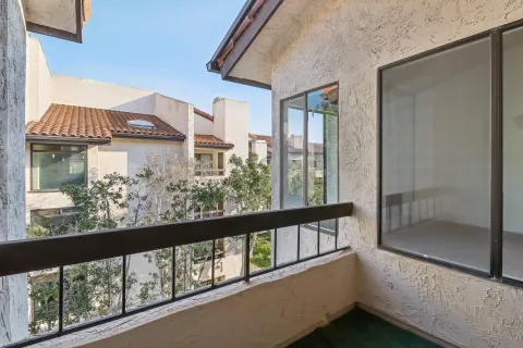 a kitchen with stainless steel appliances a refrigerator and a stove