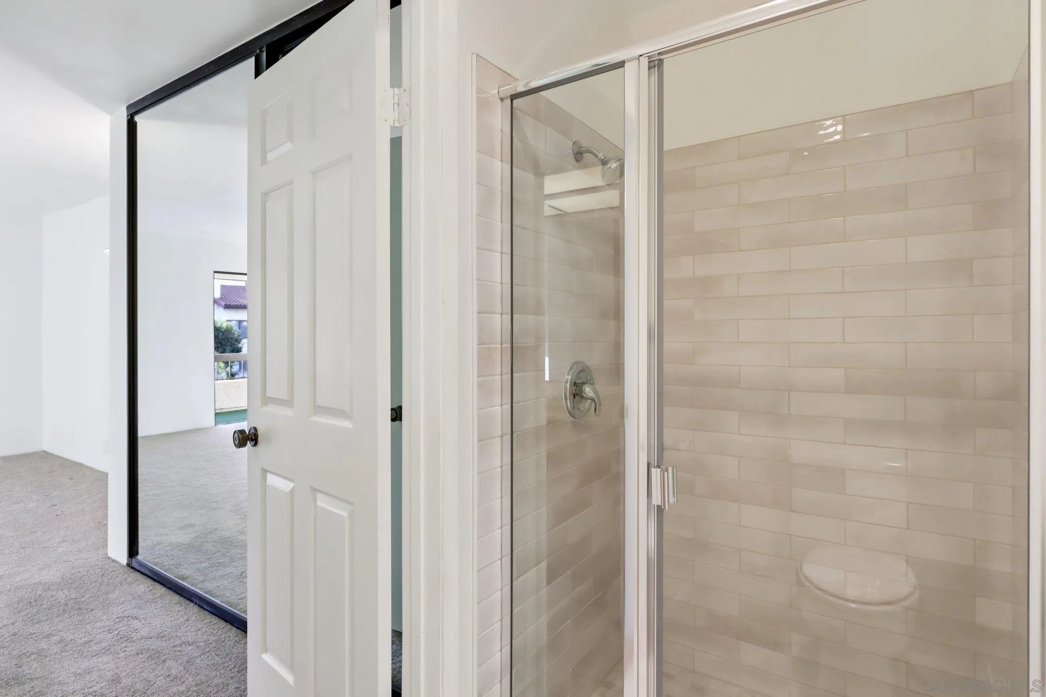 5645 Friars Road, Unit 386 San Diego, CA 92110 - Photo 35 of 72 a bathroom with a glass shower door