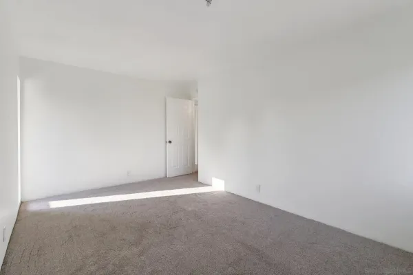 a view of roof deck with a barbeque and wooden stairs