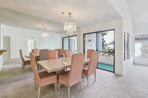 a view of a dining room with furniture and window