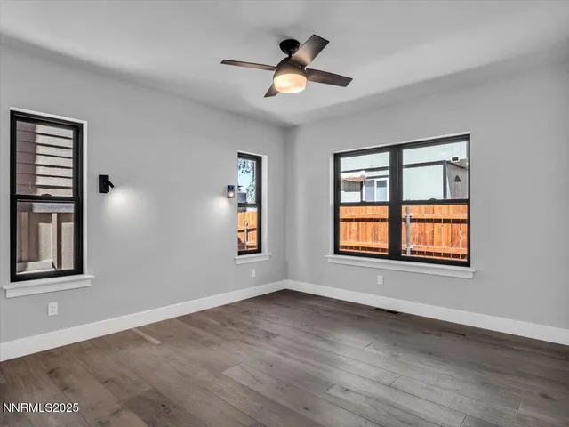 a view of a bathroom with a shower and a mirror