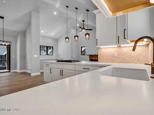 a aerial view of a house with table and chairs