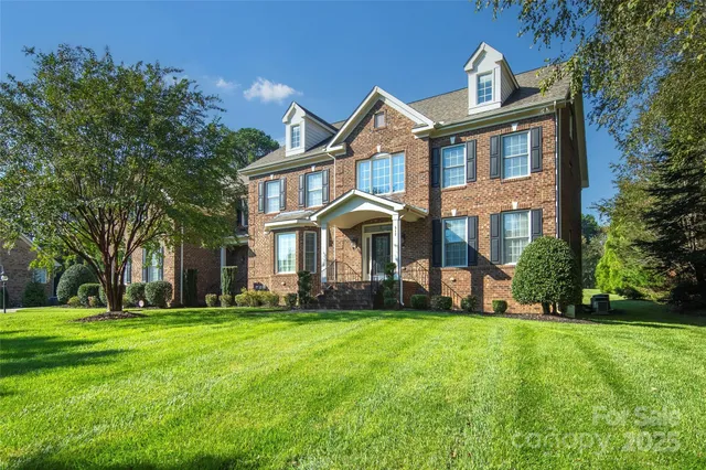 a front view of building with yard