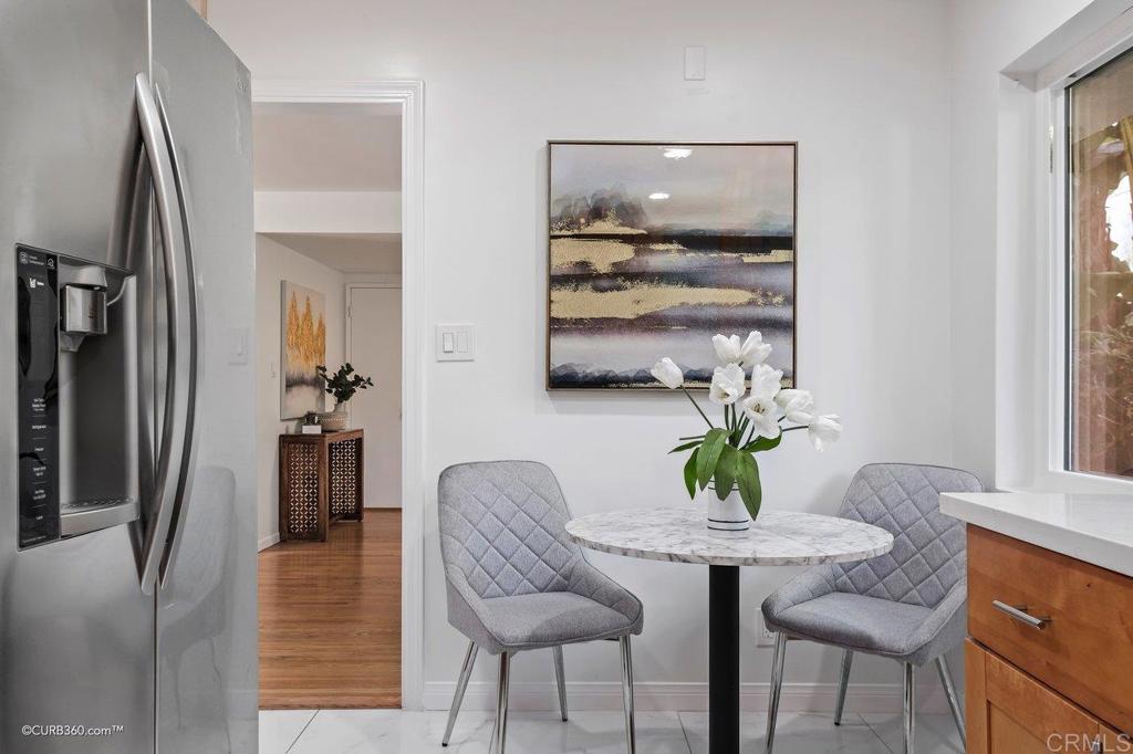 2352 Torrey Pines Road, Unit 1 La Jolla, CA 92037 - Photo 12 of 37 a view of a dining room with furniture window and wooden floor