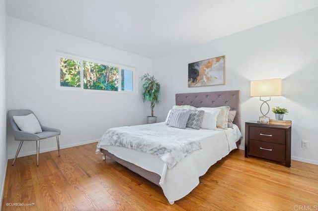 a bedroom with a bed and chair