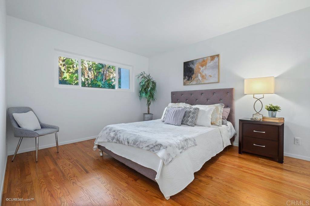 2352 Torrey Pines Road, Unit 1 La Jolla, CA 92037 - Photo 20 of 37 a bedroom with a bed and chair