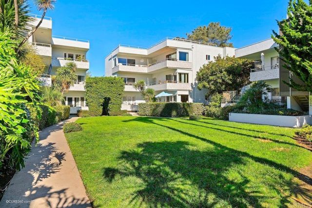 a front view of a house with a yard table and chairs