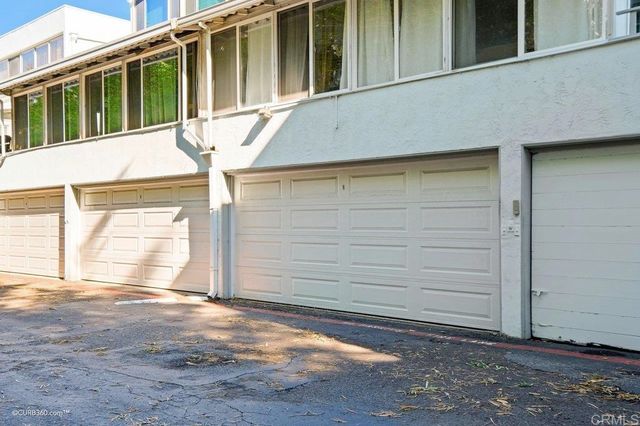a view of house with backyard