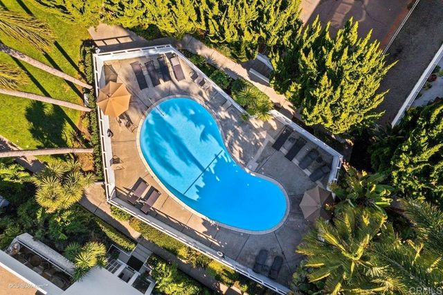 a view of a swimming pool with a yard