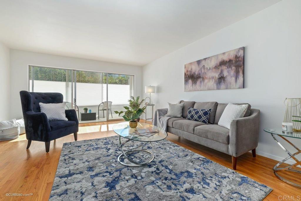2352 Torrey Pines Road, Unit 1 La Jolla, CA 92037 - Photo 5 of 37 a living room with furniture and a large window