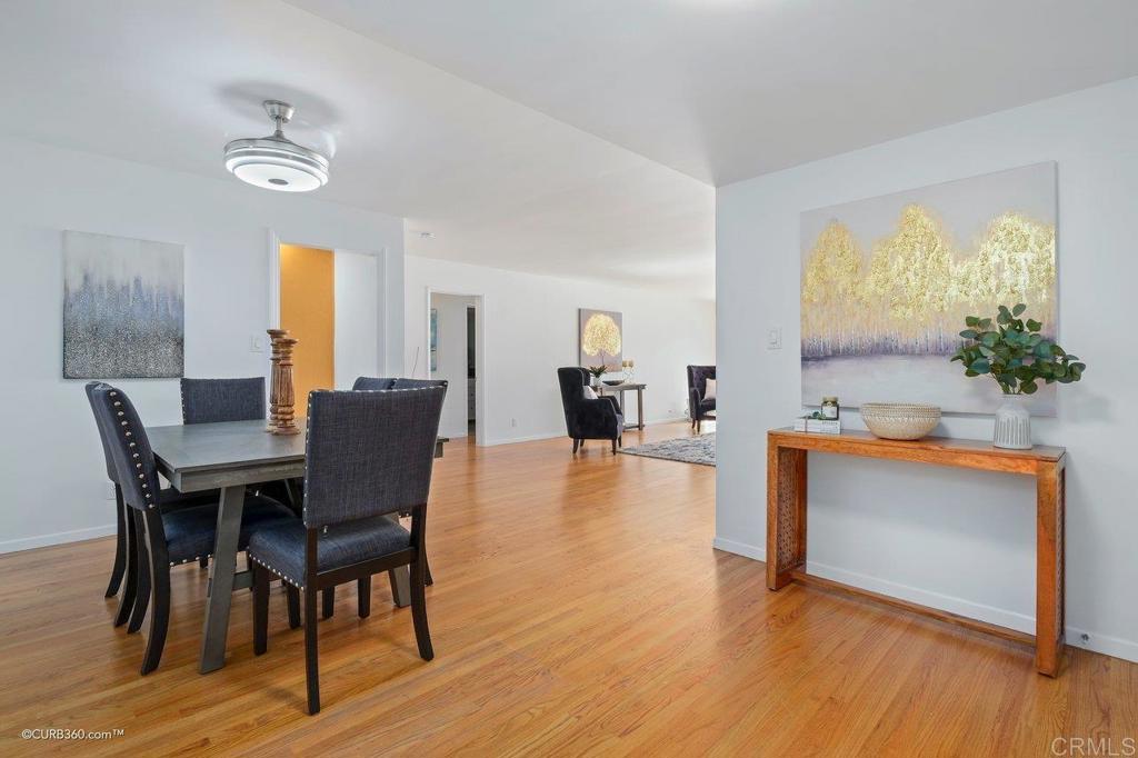 2352 Torrey Pines Road, Unit 1 La Jolla, CA 92037 - Photo 6 of 37 a view of a dining room with furniture and wooden floor