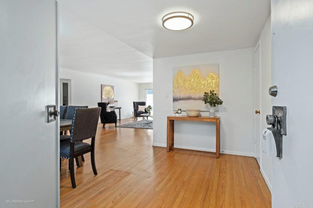 2352 Torrey Pines Road, Unit 1 La Jolla, CA 92037 - Photo 7 of 37 a living room with furniture and a table