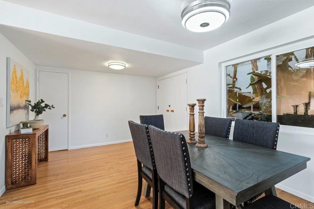 2352 Torrey Pines Road, Unit 1 La Jolla, CA 92037 - Photo 9 of 37 a view of a dining room with furniture and wooden floor