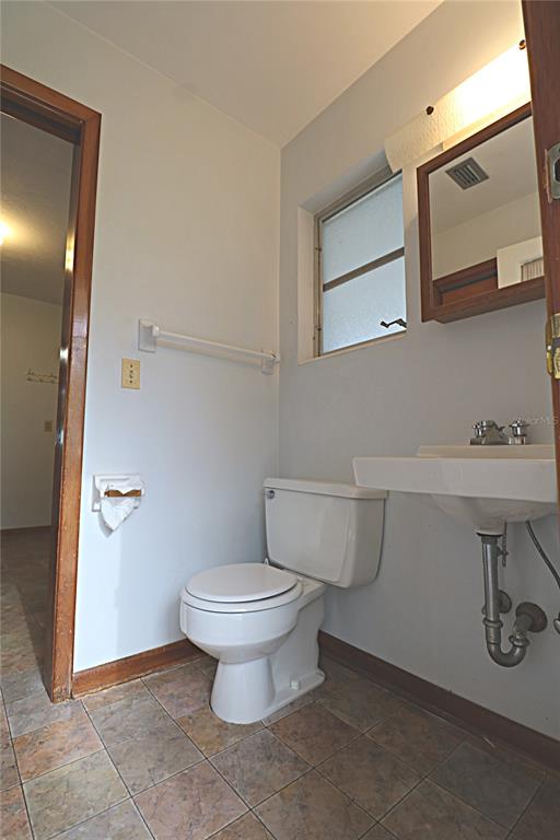 1000 Cody Cove Road Babson Park, FL 33827 - Photo 14 of 16 a bathroom with a toilet and a sink