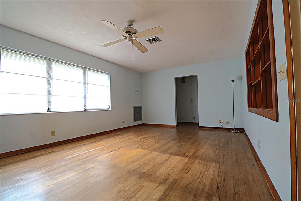 1000 Cody Cove Road Babson Park, FL 33827 - Photo 2 of 16 a view of an empty room window and wooden floor