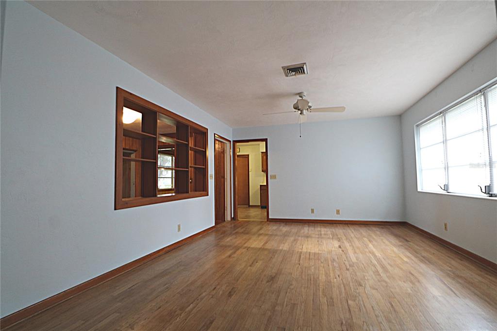 1000 Cody Cove Road Babson Park, FL 33827 - Photo 3 of 16 a view of an empty room with wooden floor and a window