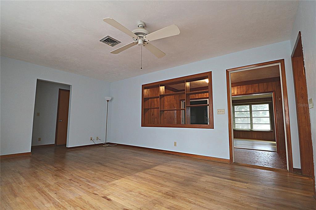 1000 Cody Cove Road Babson Park, FL 33827 - Photo 4 of 16 a view of empty room with wooden floor and fan