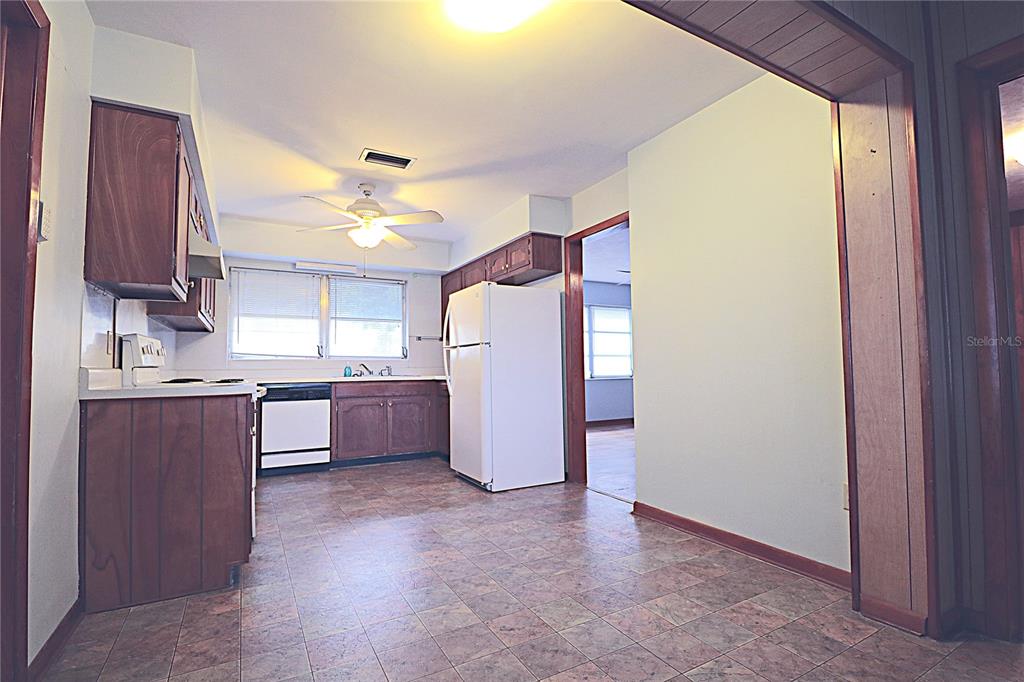 1000 Cody Cove Road Babson Park, FL 33827 - Photo 7 of 16 a kitchen with a refrigerator and a sink