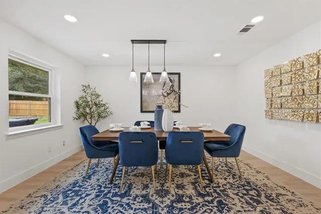 a view of a dining room with furniture
