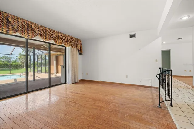 a kitchen with kitchen island granite countertop a sink appliances cabinets and a counter top space