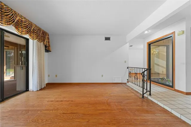 a kitchen with a sink a stove top oven and cabinets