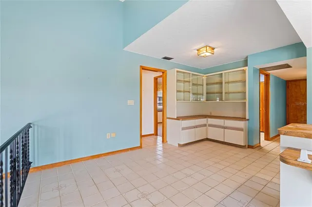 a bathroom with a sink mirror and vanity