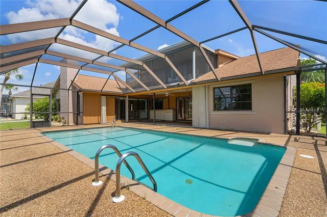 a kitchen with stainless steel appliances a sink stove and cabinets