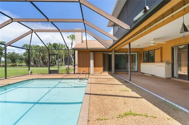 an aerial view of a house having swimming pool garden and patio