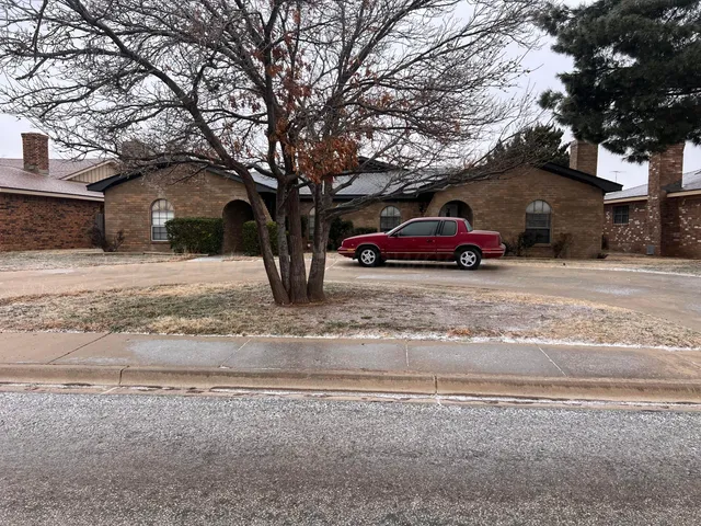 a car parked in front of a house